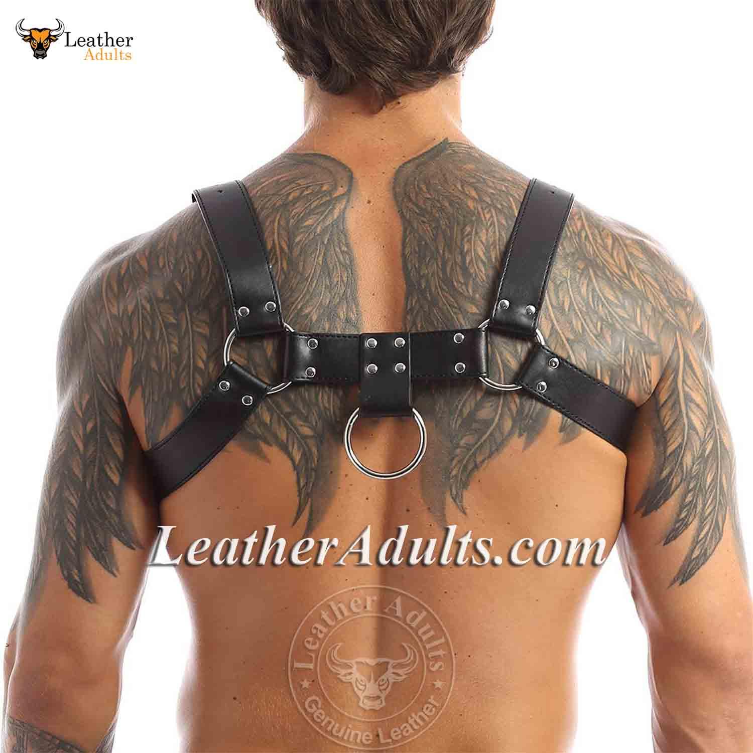 Man wearing a black leather harness with visible tattoos on a white background, featuring 'KSK Leather' branding.