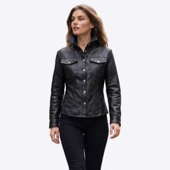 Front view of a woman wearing a tailored black leather shirt jacket with an upright stand collar, silver snap buttons, and chest pockets.