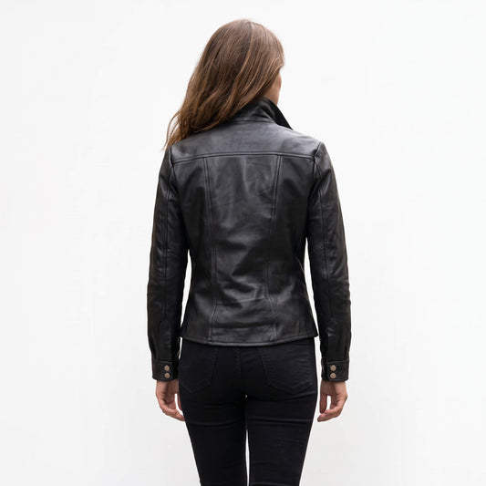 Back view displaying the horizontal yoke, vertical contour seams, and double snap cuffs on a women's black leather shacket.