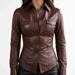 Front close up view of a woman wearing a tailored chocolate brown lambskin leather shirt with snap buttons and flap chest pockets.