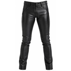 Front studio view of handmade mens black leather pants showing slanted zipper pockets, snap waistband, and slim leg taper