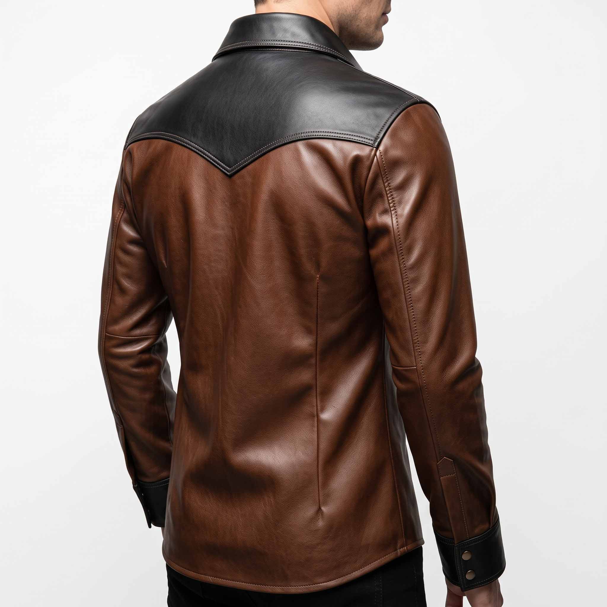 Back view of man modeling brown cowhide leather western shirt displaying deep V shaped black shoulder yoke and tailored back seams