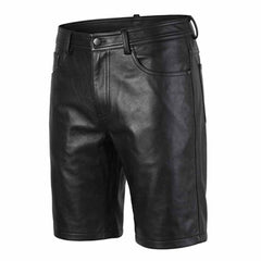 Three-quarter front angle of men's long black leather shorts showcasing smooth leather texture, front coin pocket, and clean hemmed leg openings.