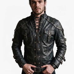 Front view of handsome man wearing handmade black leather gothic shirt jacket featuring lace up neck collar, front zipper placket with metal dome rivets, and buckled chest pockets