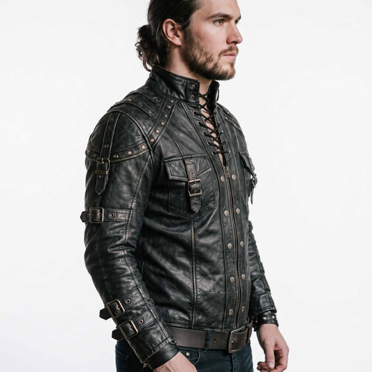 Side profile angle of man modeling black cowhide leather steampunk doublet showing studded shoulder harness bands and multi buckle sleeve straps