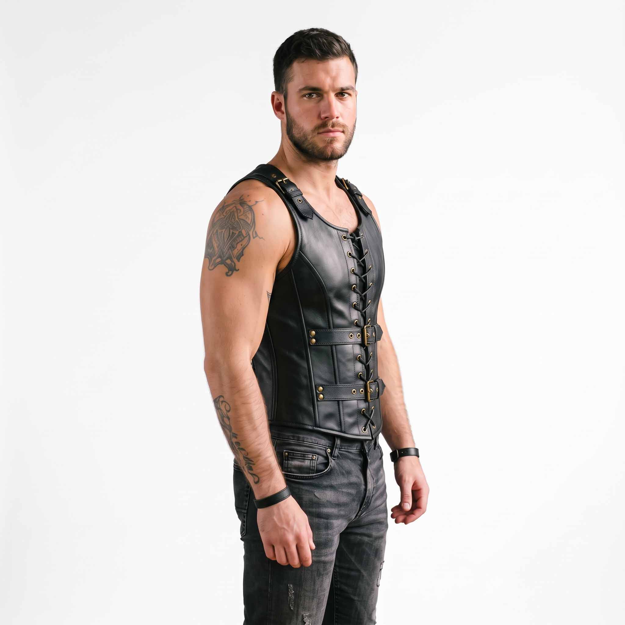 Side profile three quarter view of man wearing tailored black leather steampunk jerkin showing deep armhole cut and flank lacing