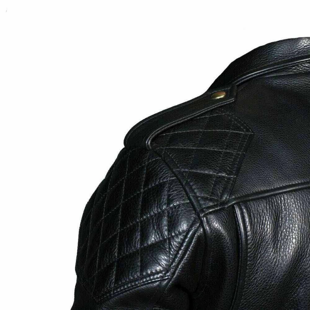 Close-up detail of the diamond-quilted shoulder panel, snap epaulette, and natural grain texture on a men's black cowhide leather jacket.