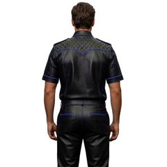 Man wearing a black leather outfit with blue stitching on a white background