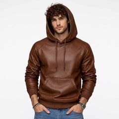 Full front shot of handsome curly haired man wearing handmade brown sheepskin leather hoodie with hood up and hands in pockets