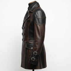 Side profile angle of tailored brown and black leather gothic jacket detailing padded shoulder caps, flap hip pockets, and buckled wrist cuffs