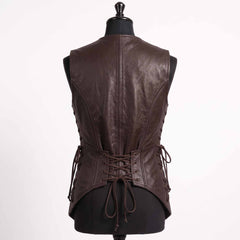 Close up side view of dark brown leather vest detailing brass side lacing grommets, leather ties, roller buckle belt, and cargo hip pocket
