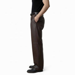 Side profile view of men's brown leather dress pants showing the comfortable regular fit and clean side pocket styling.