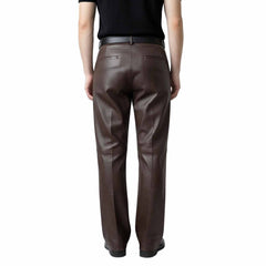 Rear view of men's brown leather formal trousers highlighting tailored back pockets and a sharp, polished silhouette.