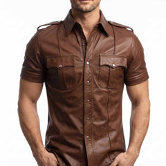 Close-up shot of the snap button closure, flap pockets, and shoulder detail on a men's brown leather uniform shirt.