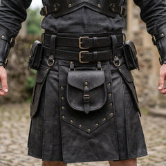 Close up view of black leather utility kilt detailing double buckle waistband, riveted front sporran pouch, and side cargo bags