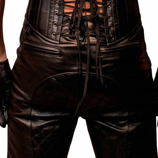 Back view of men's black cowhide leather shorts featuring a lace-up corset waist, quilted seat panel, and horizontal zipped rear pockets.