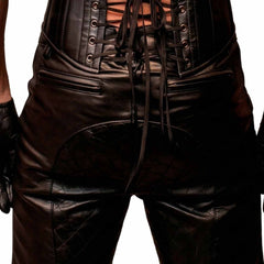 Back view of men's black cowhide leather shorts featuring a lace-up corset waist, quilted seat panel, and horizontal zipped rear pockets.