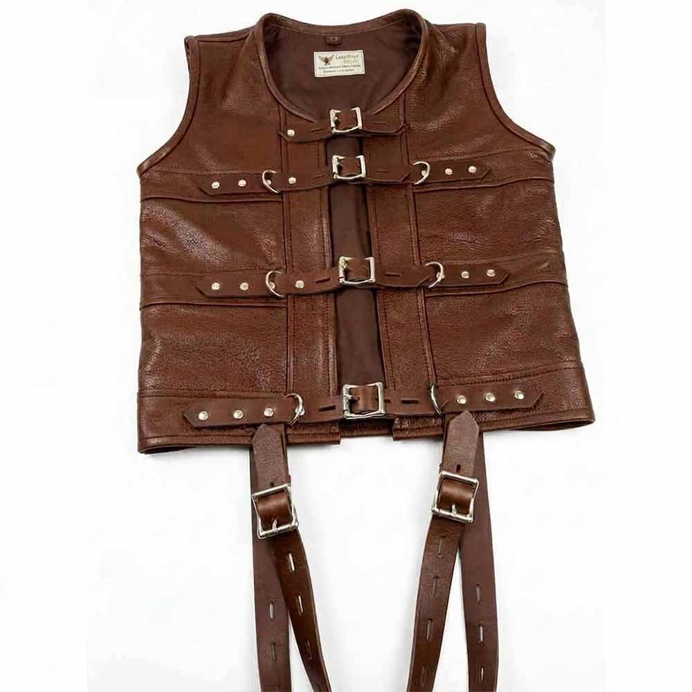 A brown leather corset vest featuring four lockable buckle straps and side D-rings. and long suspenders, laid flat on a white background.