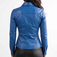 Back close up view showing the contoured seam stitching and structured shoulder yoke of a women's fitted blue leather blouse.