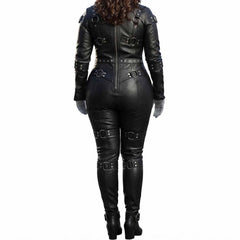 Rear view of a woman wearing a black genuine leather full body bondage restraint suit, showcasing the vertical back zipper and multiple buckled straps.