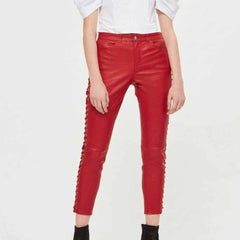 Front view of model wearing women's red sheepskin capri leather pants with side lace-up grommet detail