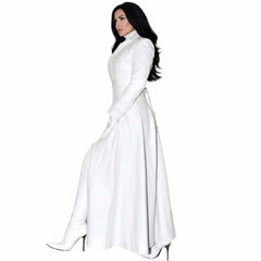 ide view of a woman wearing a floor-length white real Nappa leather trench coat dress styled with white high-heeled boots.