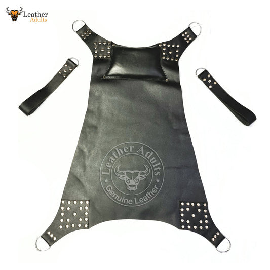 A black leather sex swing with spiked rivets and two stirrups, featuring the brand 'LEATHER ADULTS' embossed on the surface.