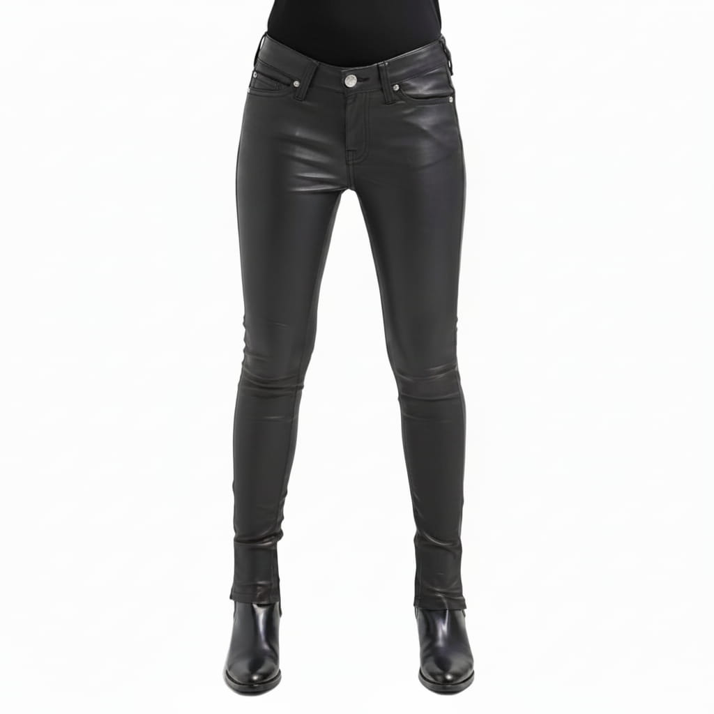 Black leather skinny pants shown on a model from the waist down, paired with a black top and black leather ankle boots, against a plain white background.