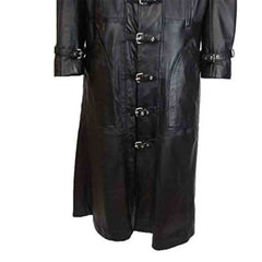 Close-up of silver metal buckle fasteners and double-stitched seams on a men's black real leather duster coat.